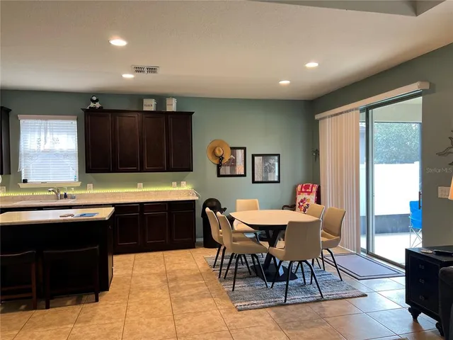 a kitchen with a table and chairs in it