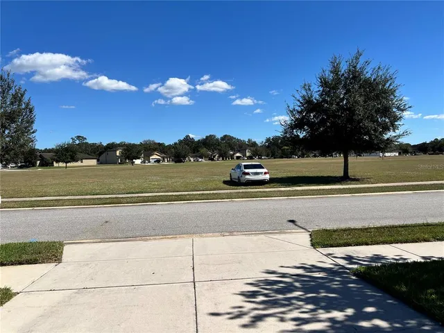 a view of front door and yard