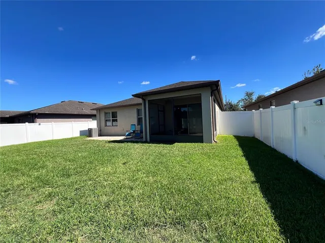 a view of a chairs and table in a room