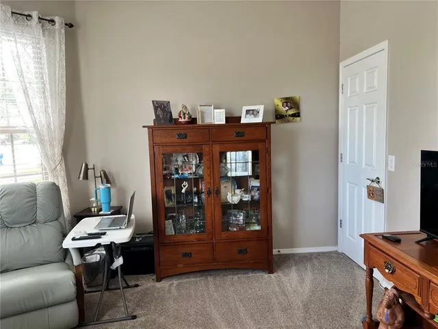 a living room with furniture and window