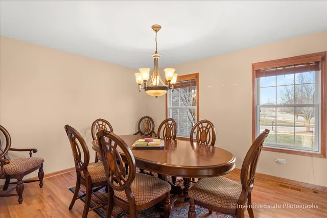 a view of a dining room with furniture window and outside view