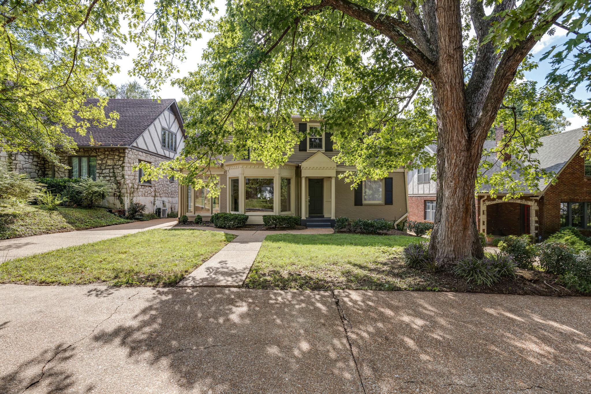 111 Mockingbird Road Nashville, TN 37205 - Photo 2 of 49 a front view of a house with a yard and an tree