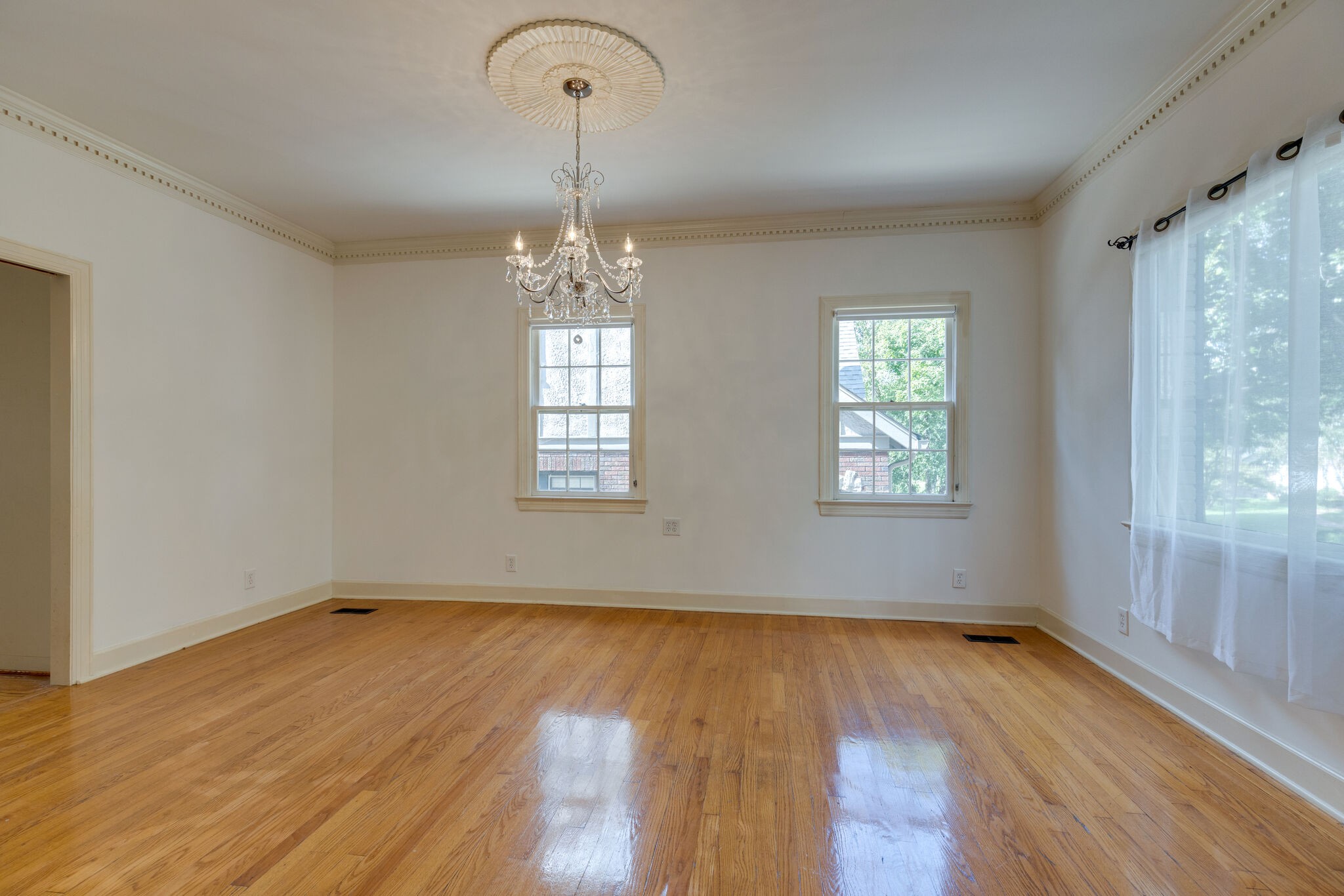 111 Mockingbird Road Nashville, TN 37205 - Photo 11 of 49 wooden floor in an empty room with a window
