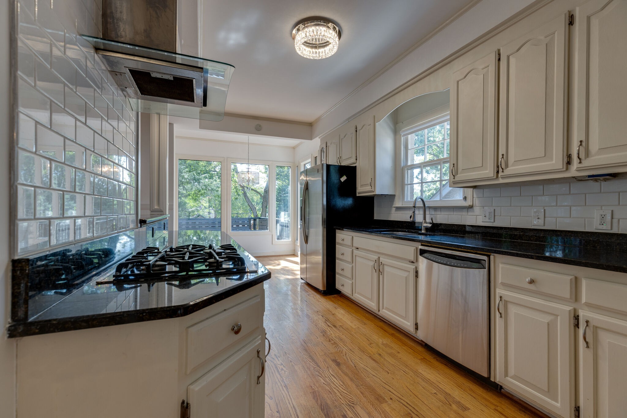 111 Mockingbird Road Nashville, TN 37205 - Photo 13 of 49 a kitchen with stainless steel appliances a sink a stove a refrigerator and cabinets