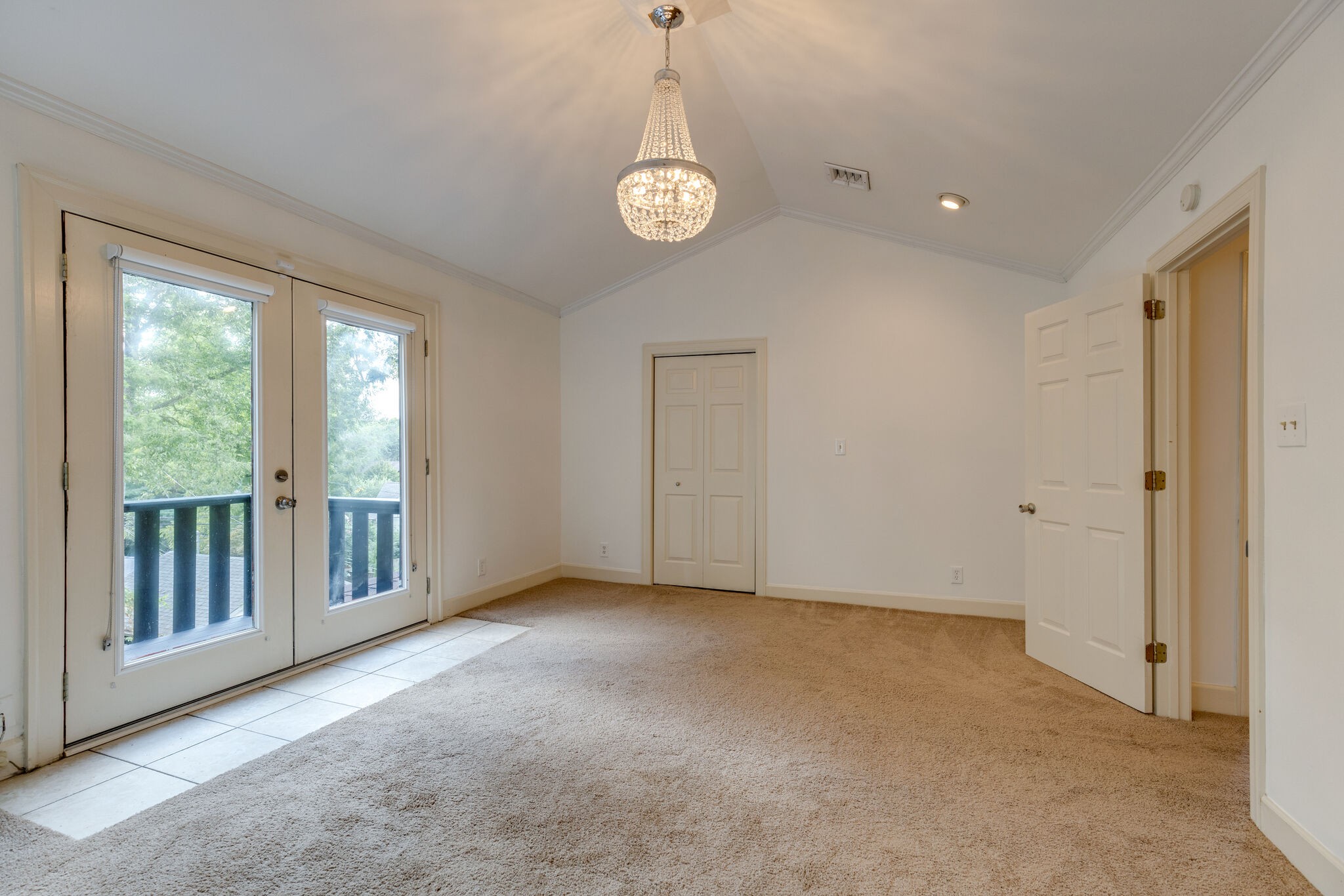 111 Mockingbird Road Nashville, TN 37205 - Photo 30 of 49 a view of an empty room with a window and wooden floor