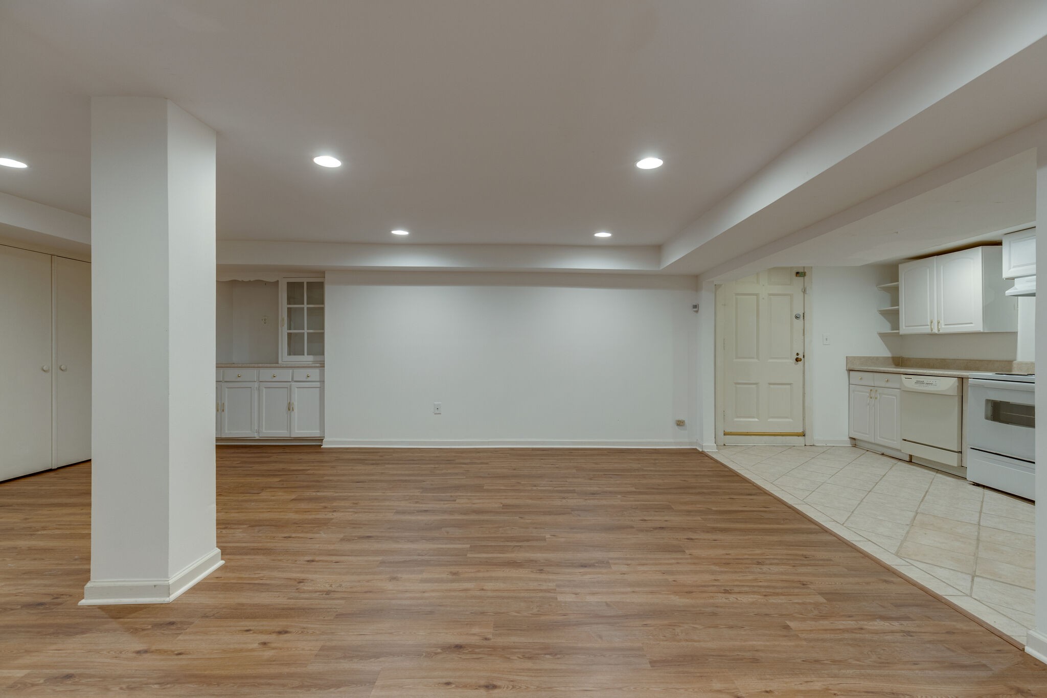 111 Mockingbird Road Nashville, TN 37205 - Photo 35 of 49 a view of empty room with wooden floor and kitchen