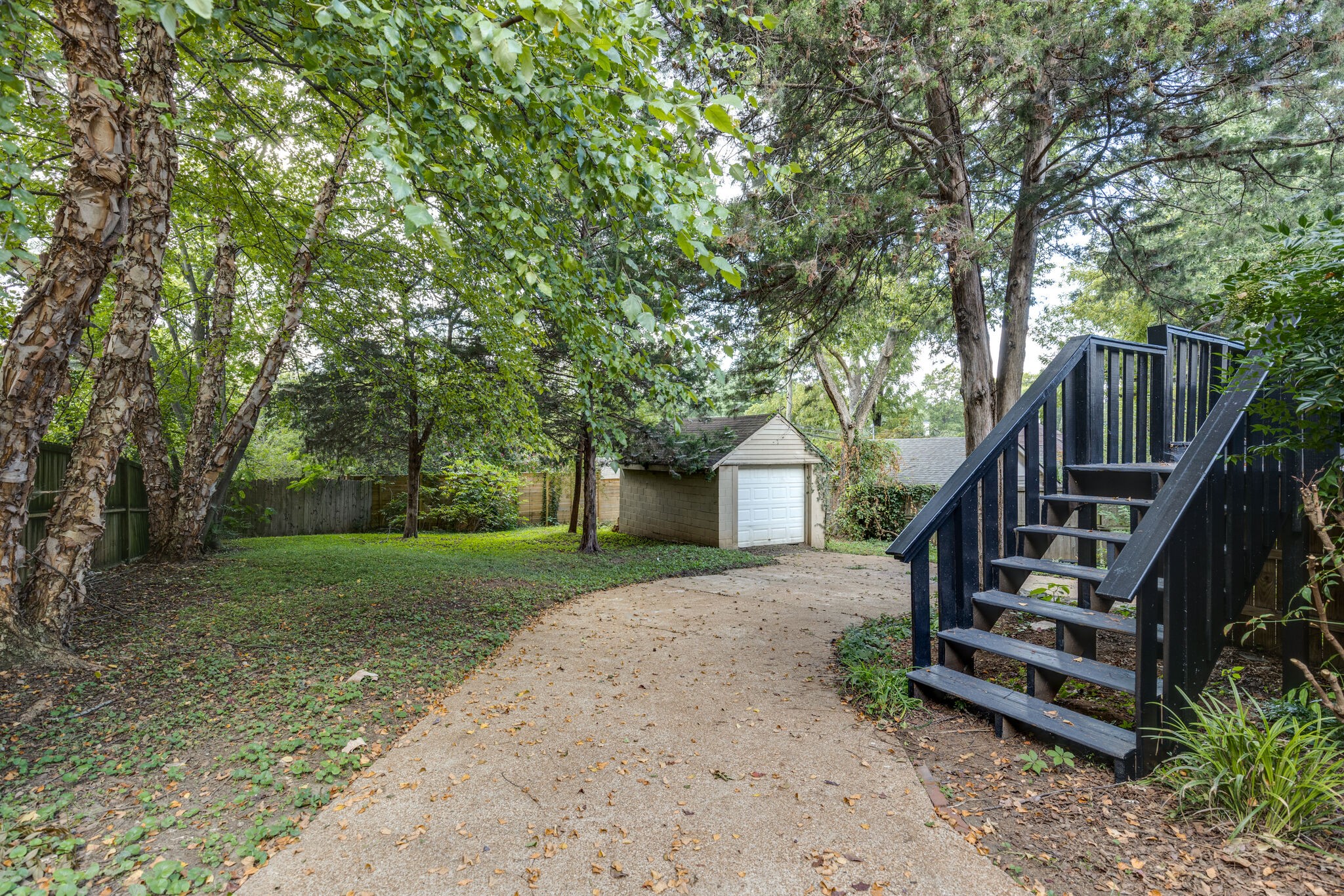 111 Mockingbird Road Nashville, TN 37205 - Photo 47 of 49 a view of a house with wooden deck and a trees