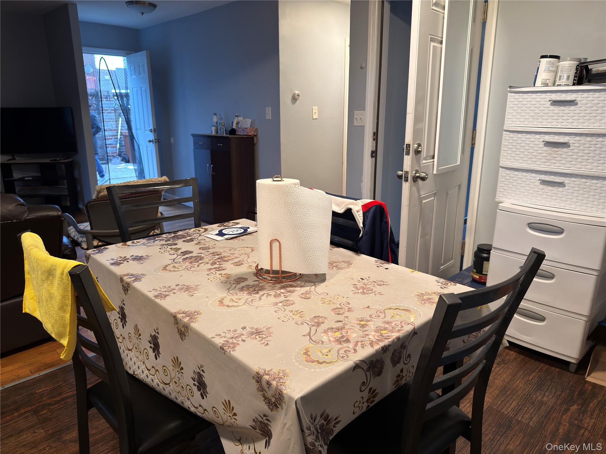 55-16 69th Street Queens, NY 11378 - Photo 7 of 28 a dining room with furniture and wooden floor