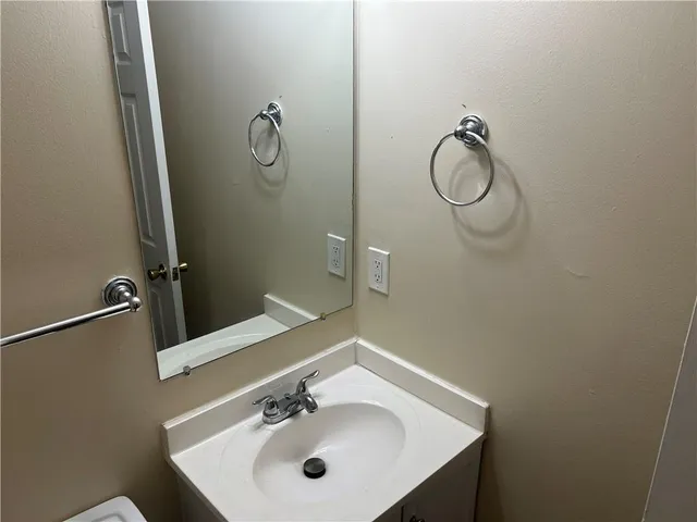 a bathroom with a sink and mirror