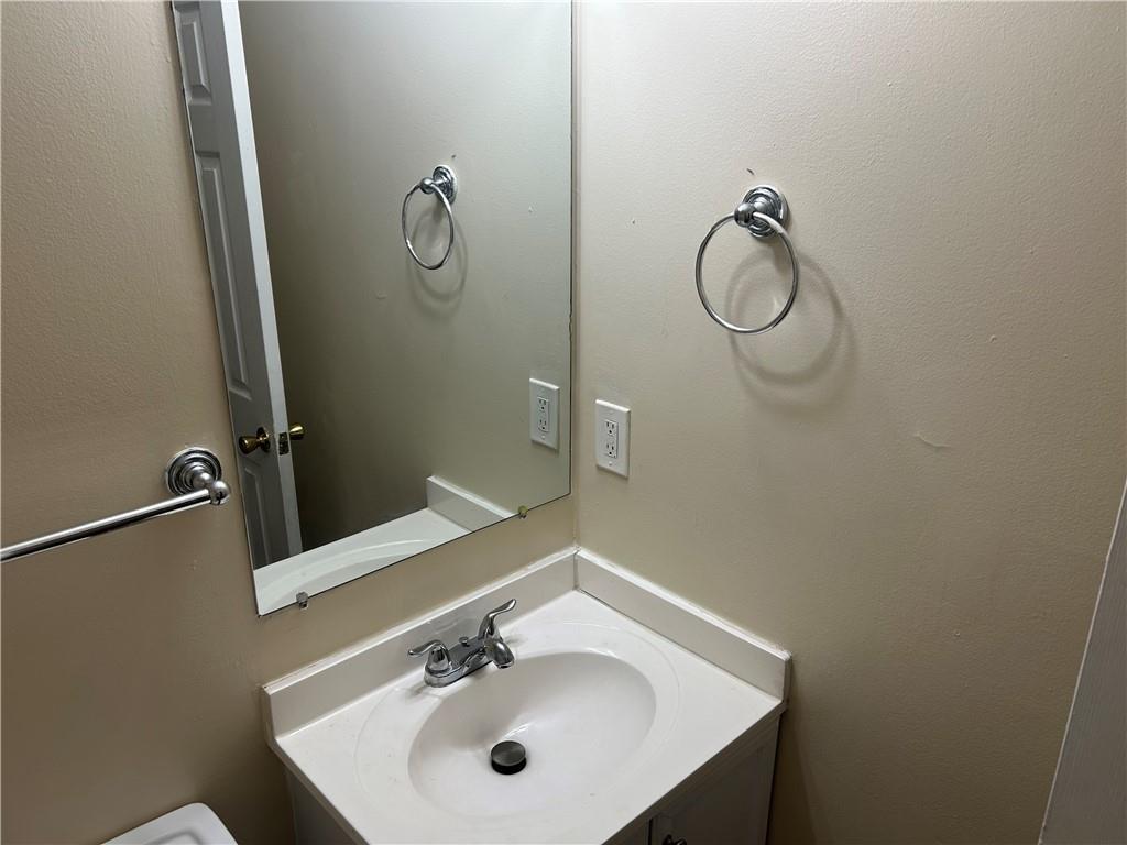 5323 Scarbrough Round Stone Mountain, GA 30088 - Photo 7 of 13 a bathroom with a sink and mirror