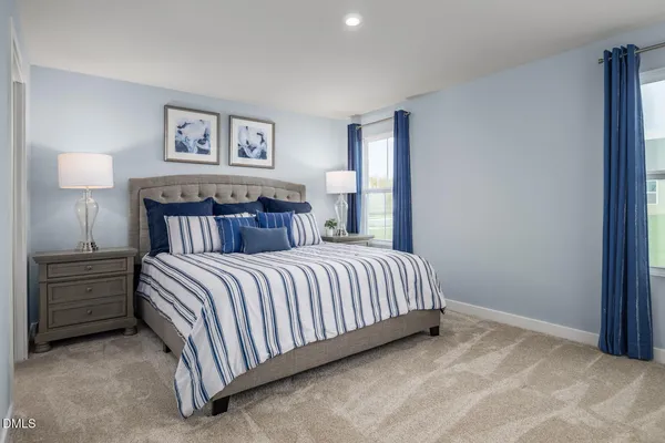 a bedroom with a bed and wall painting