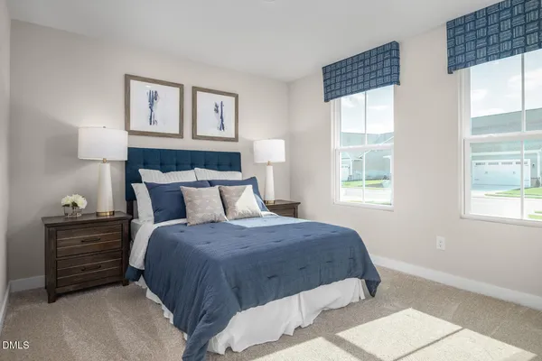 a bedroom with double bed and a window