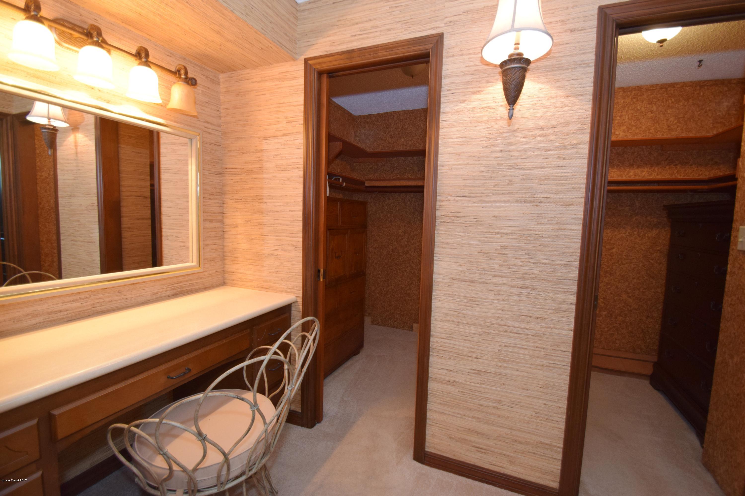 4200 Pinewood Road Melbourne, FL 32934 - Photo 22 of 40 Master Suite Vanity Area and Walk In Clo