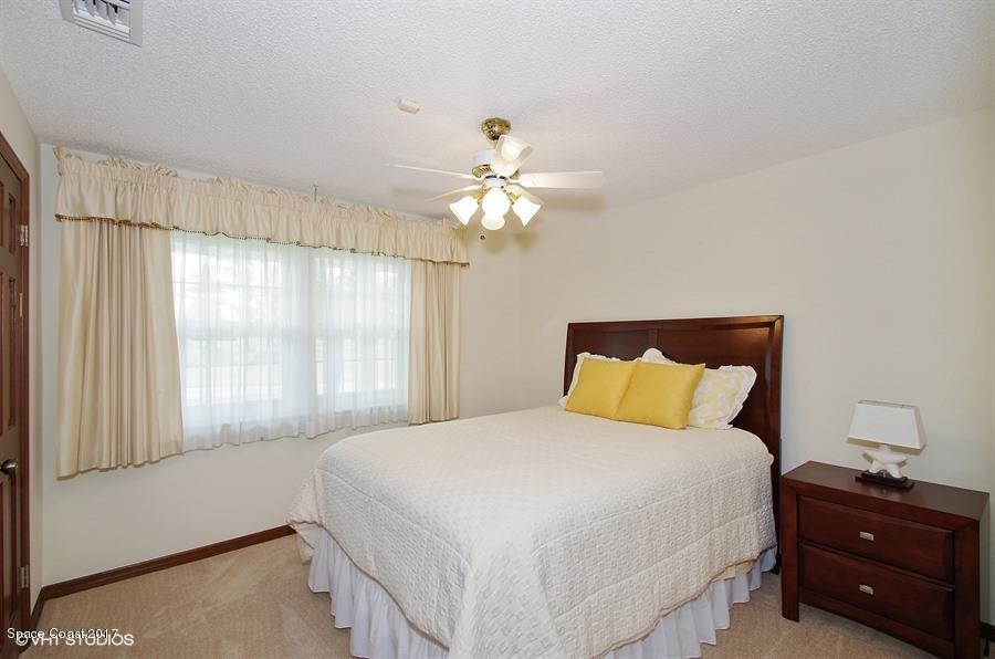 4200 Pinewood Road Melbourne, FL 32934 - Photo 25 of 40 10_4200PinewoodRd_153_2ndBedroom_LowRes