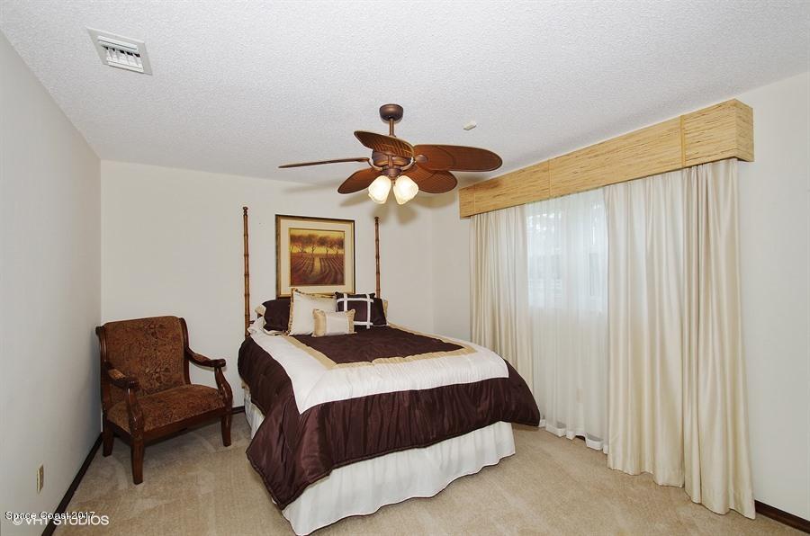 4200 Pinewood Road Melbourne, FL 32934 - Photo 29 of 40 11_4200PinewoodRd_154_3rdBedroom_LowRes