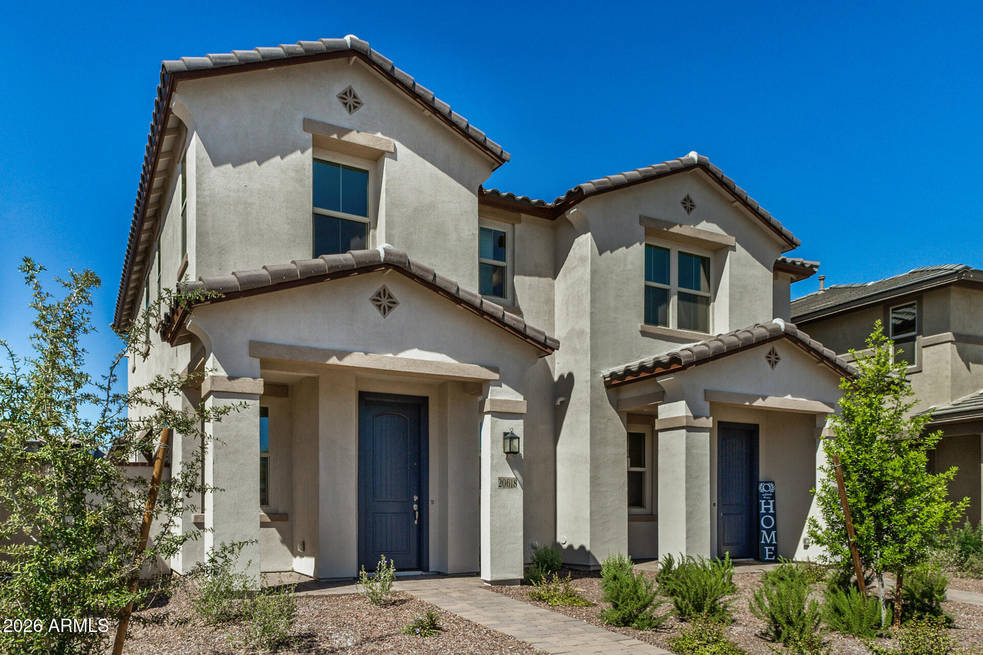 20618 West Thomas Road Buckeye, AZ 85396 - Photo 34 of 38 a front view of a house with a yard