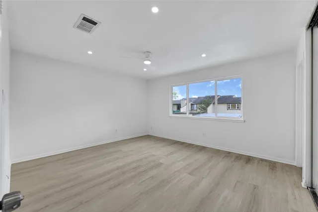 a view of an empty room and window