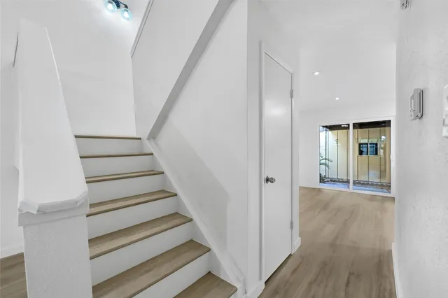 a view of entryway with wooden floor