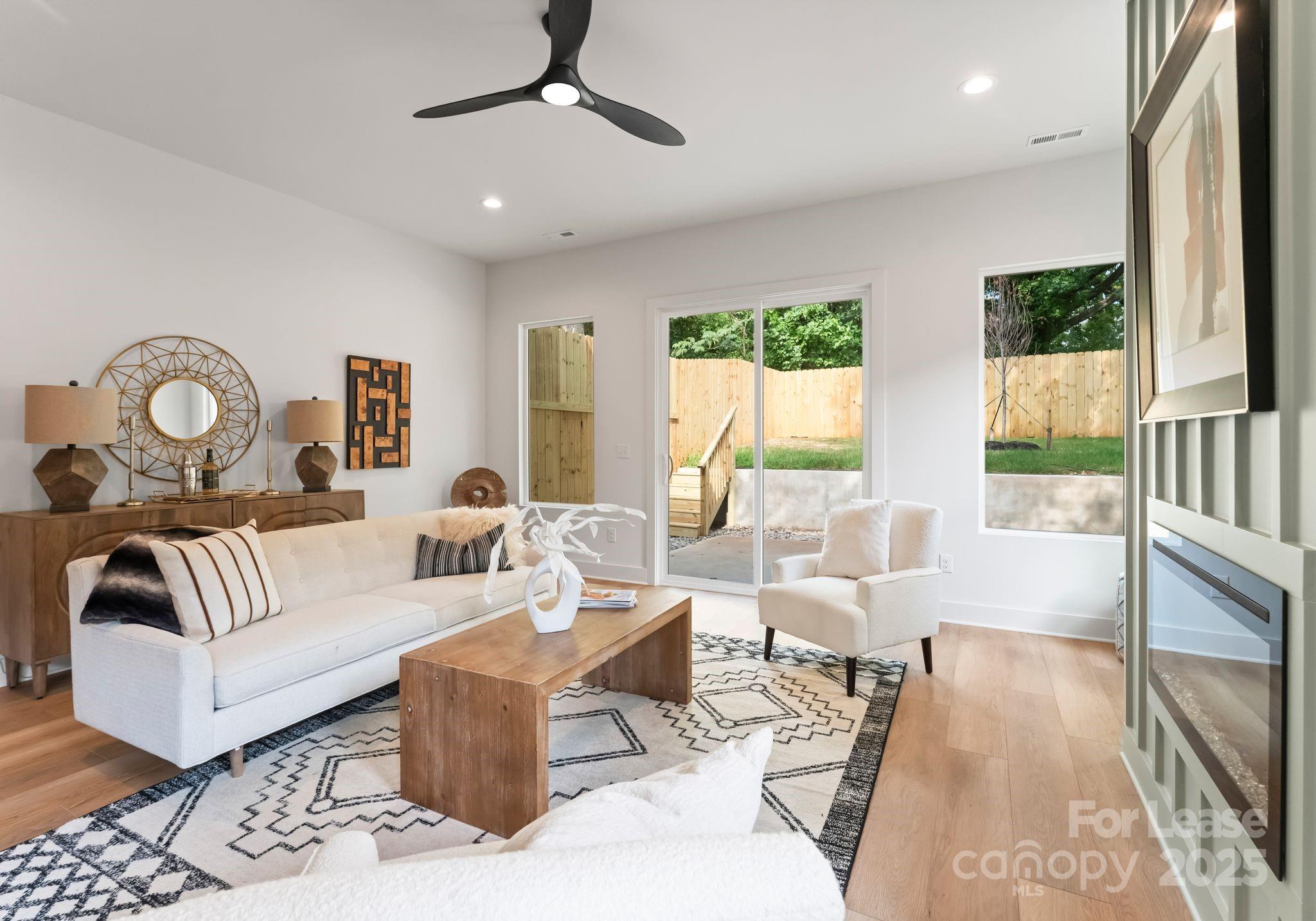 2413 Pruitt Street Charlotte, NC 28208 - Photo 12 of 35 a living room with furniture and a large window