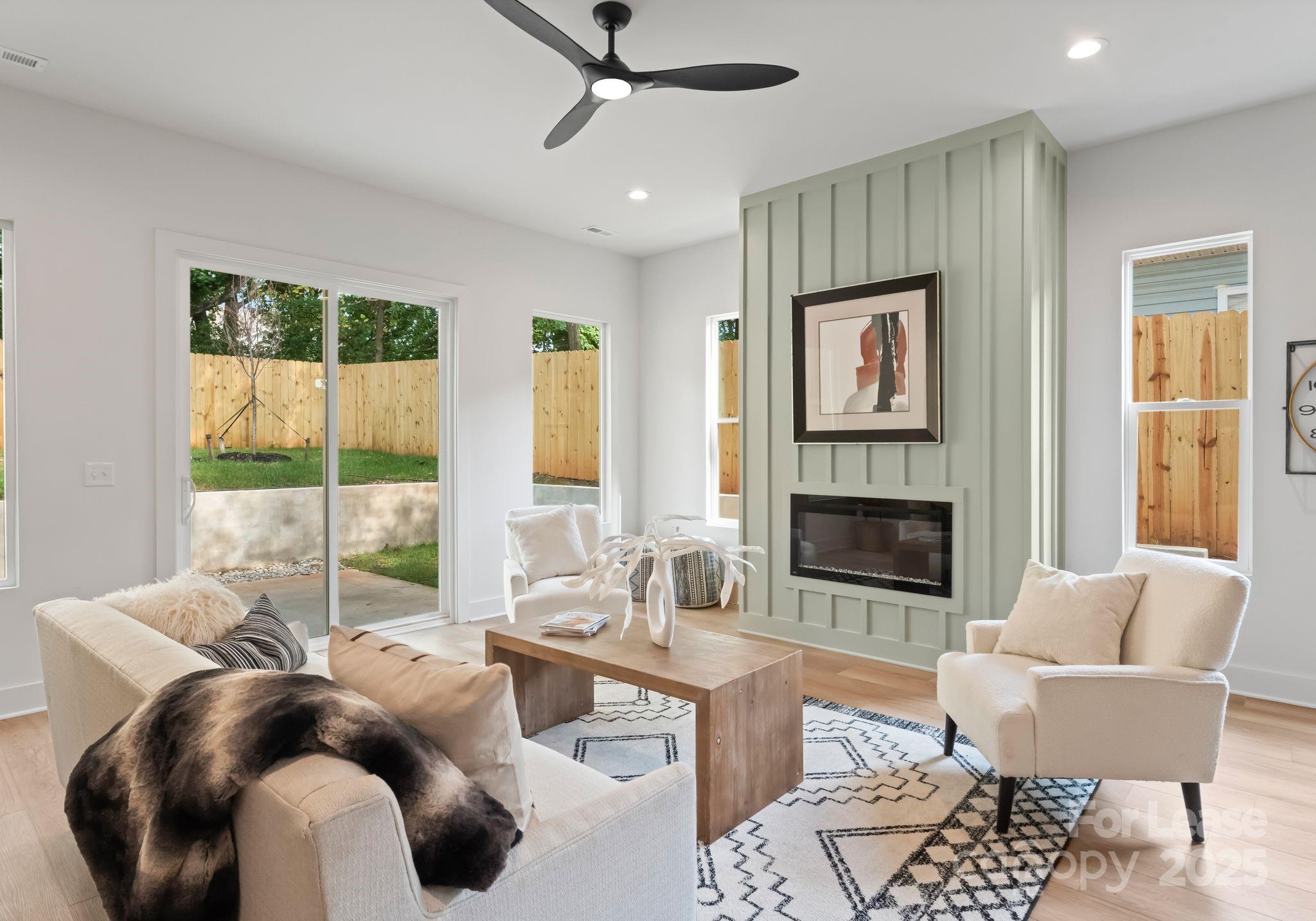 2413 Pruitt Street Charlotte, NC 28208 - Photo 14 of 35 a living room with furniture and a fireplace