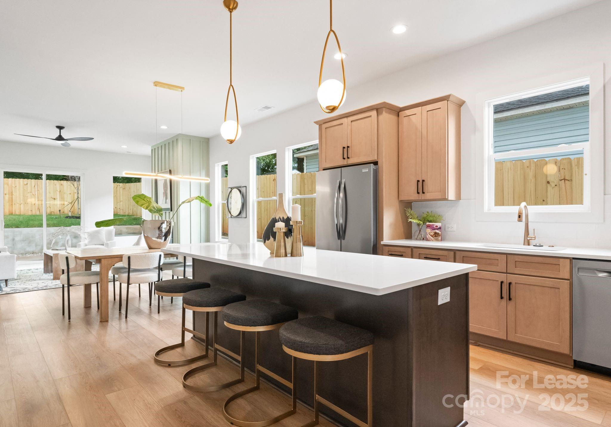 2413 Pruitt Street Charlotte, NC 28208 - Photo 27 of 35 a dining table with chairs and window
