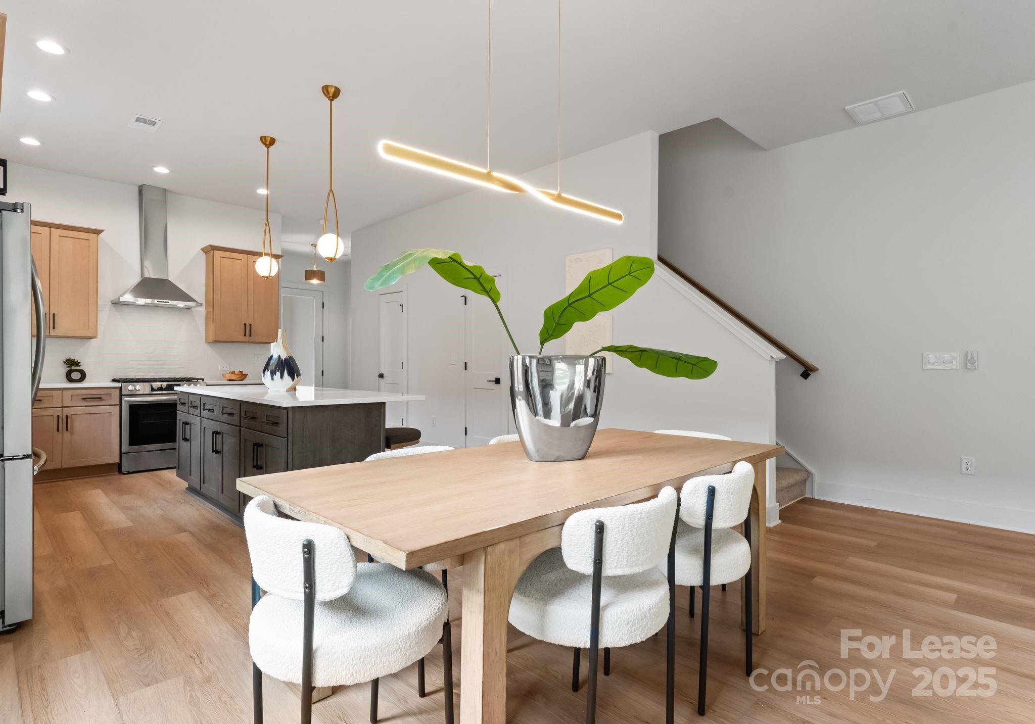 2413 Pruitt Street Charlotte, NC 28208 - Photo 32 of 35 a view of kitchen with cabinets and wooden floor