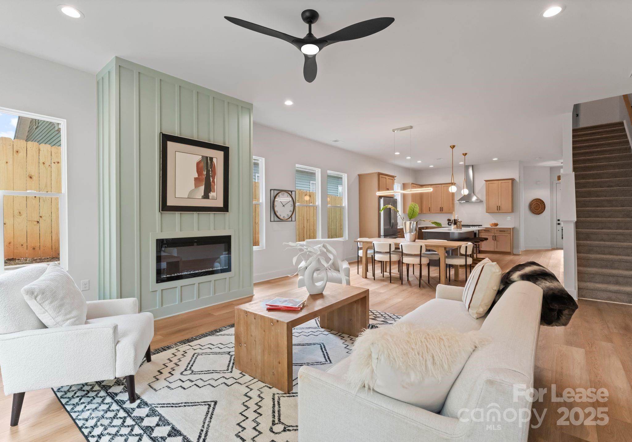 2413 Pruitt Street Charlotte, NC 28208 - Photo 34 of 35 a living room with furniture and a fireplace