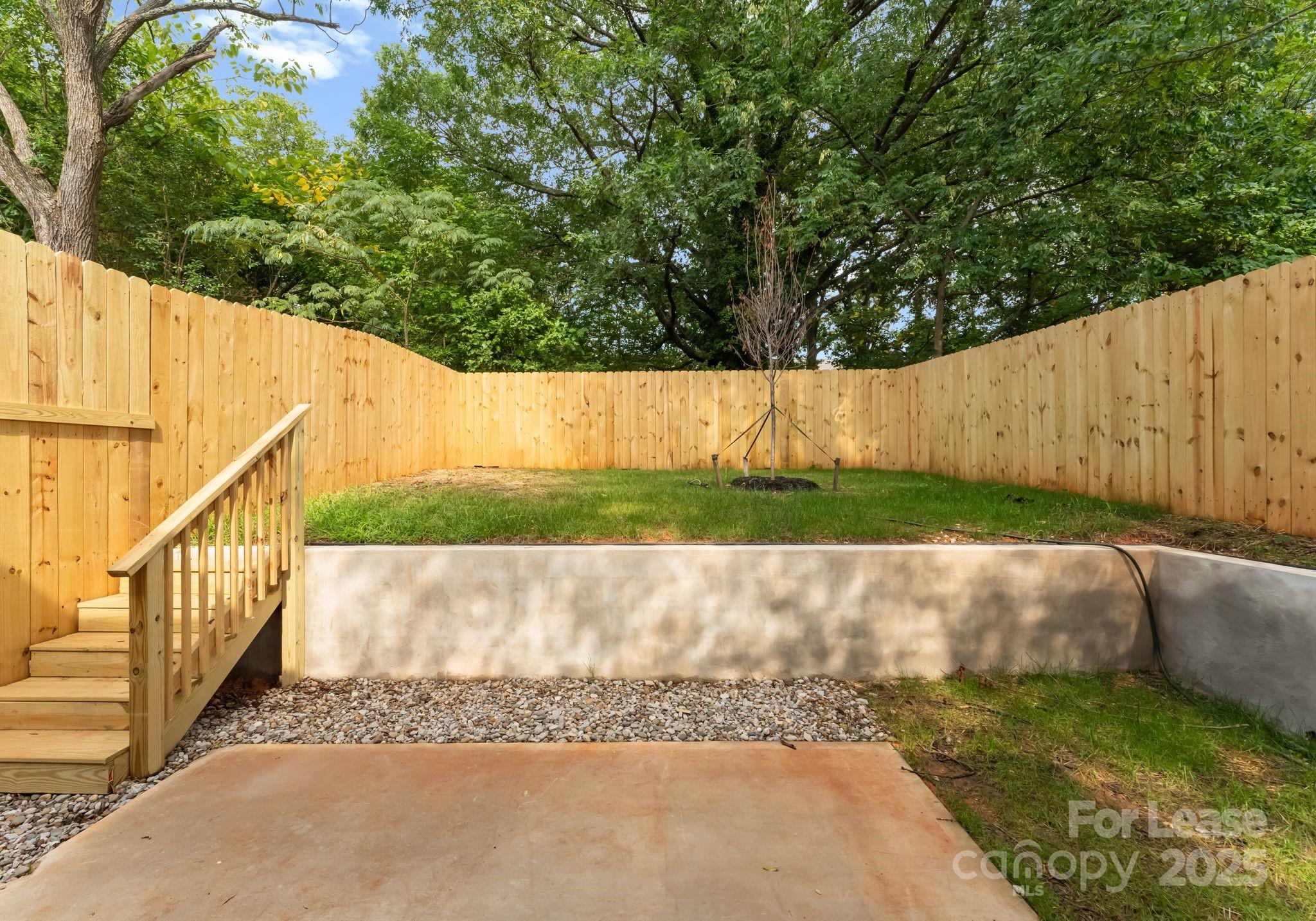 2413 Pruitt Street Charlotte, NC 28208 - Photo 5 of 35 a view of backyard with green space
