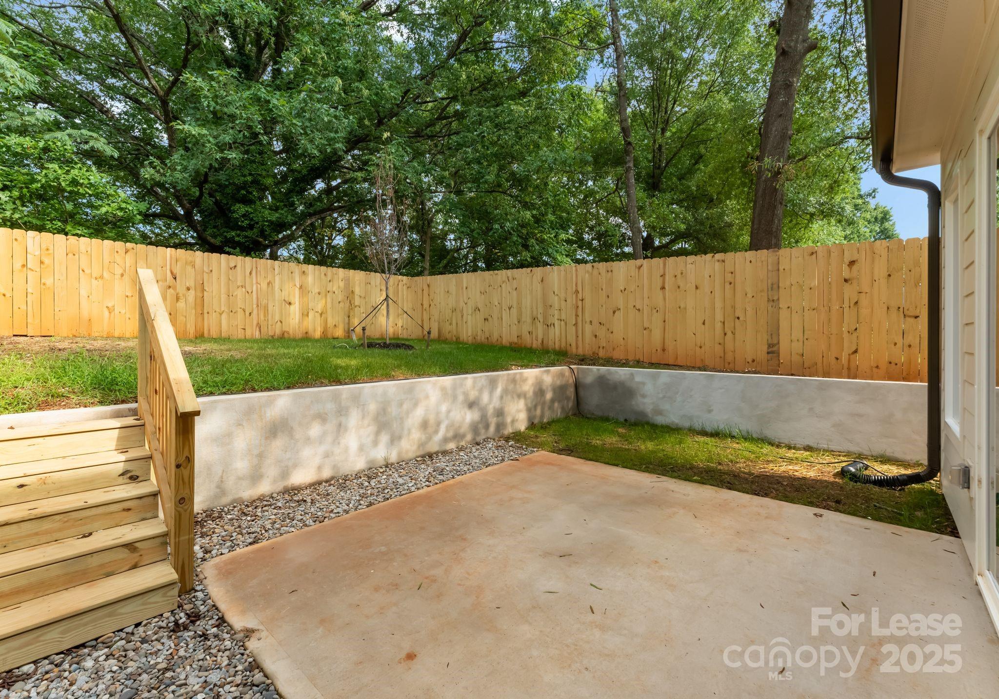 2413 Pruitt Street Charlotte, NC 28208 - Photo 6 of 35 a view of backyard with green space