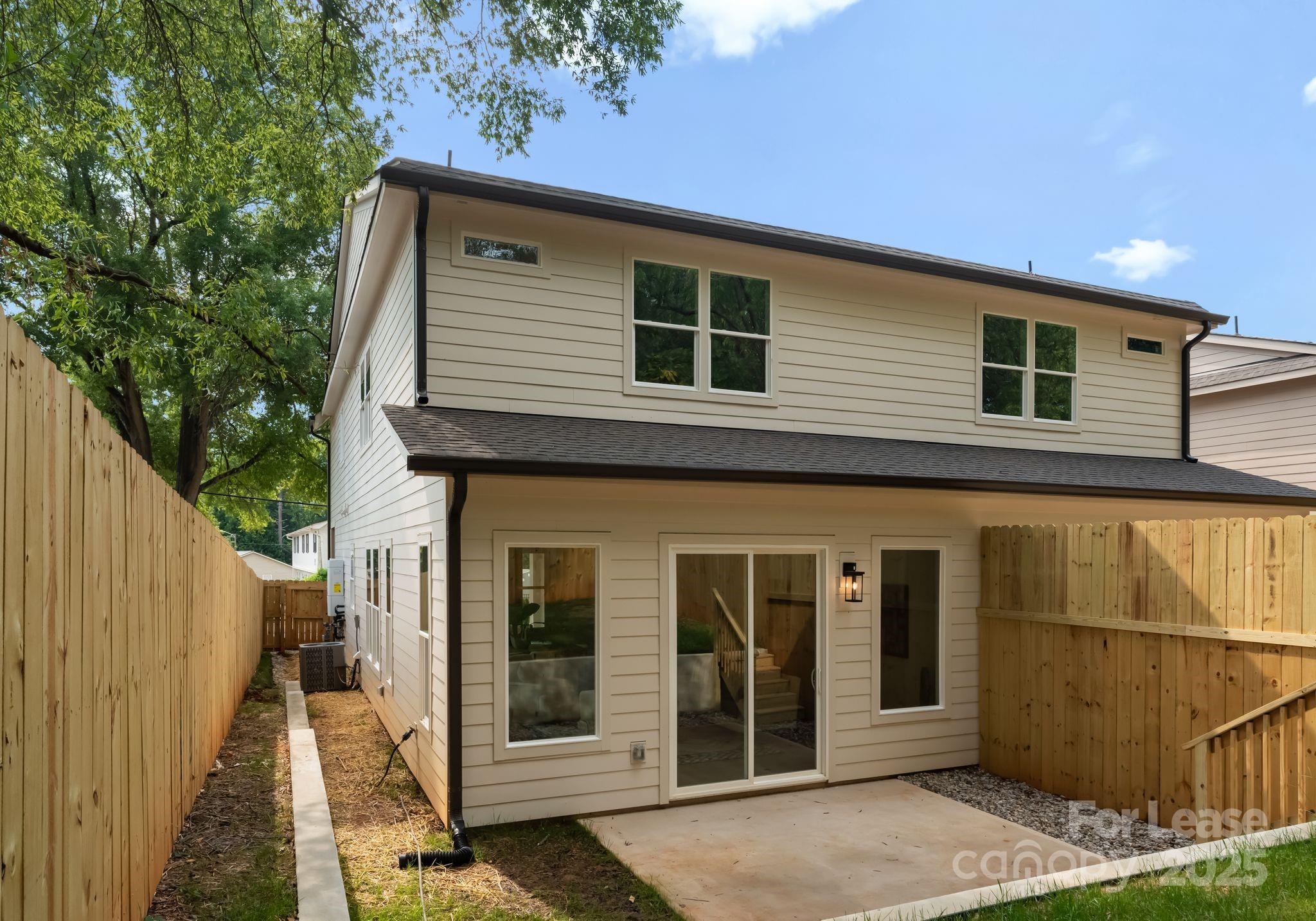 2413 Pruitt Street Charlotte, NC 28208 - Photo 9 of 35 a side view of a house with a porch
