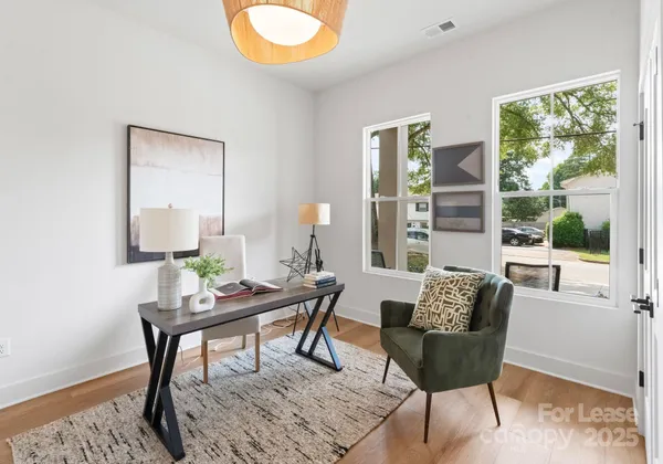 a work room with furniture and a window