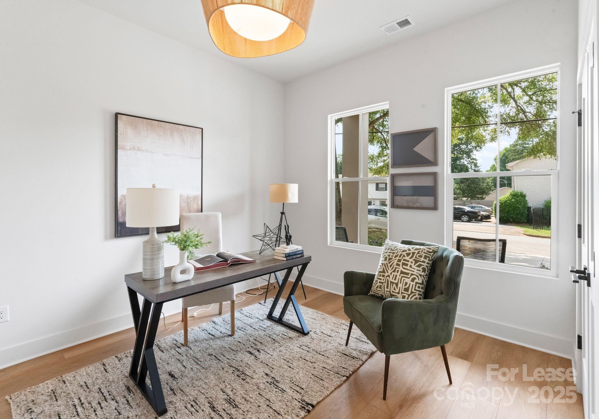 2413 Pruitt Street Charlotte, NC 28208 - Photo 10 of 35 a work room with furniture and a window
