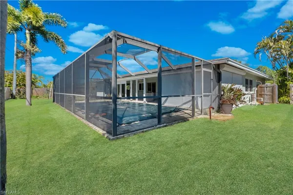 a view of a house with a yard porch and sitting area