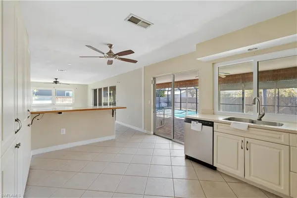 a kitchen with a sink and cabinets