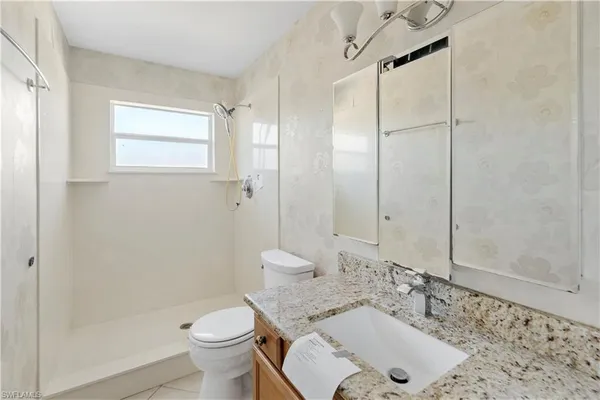 a bathroom with a sink and a toilet