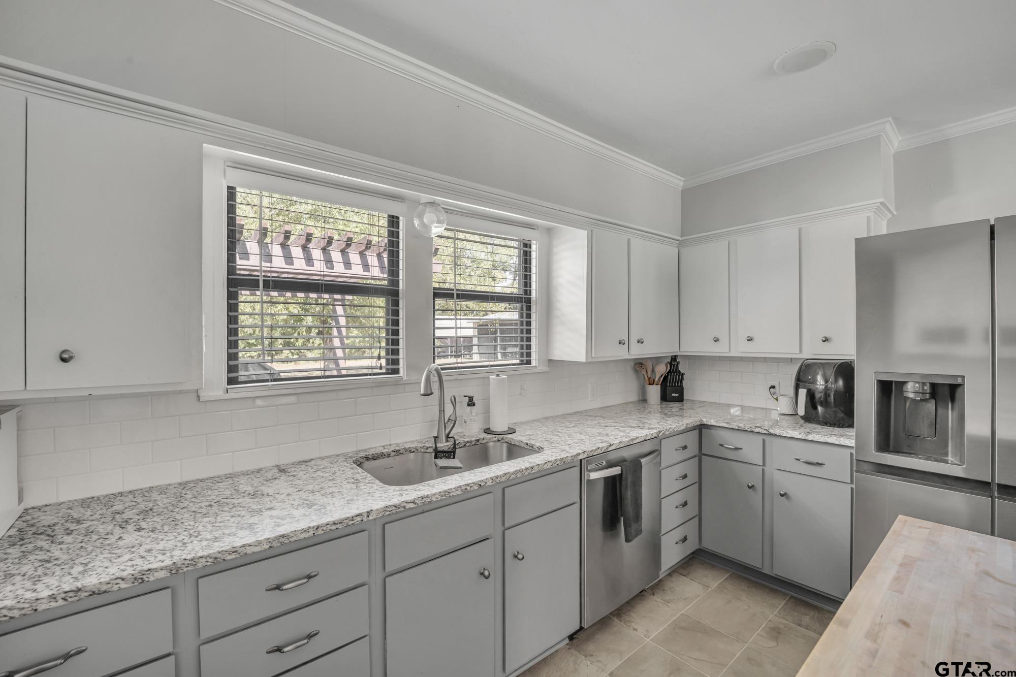 3601 Dumas Road Longview, TX 75604 - Photo 13 of 27 a kitchen with sink cabinets and window