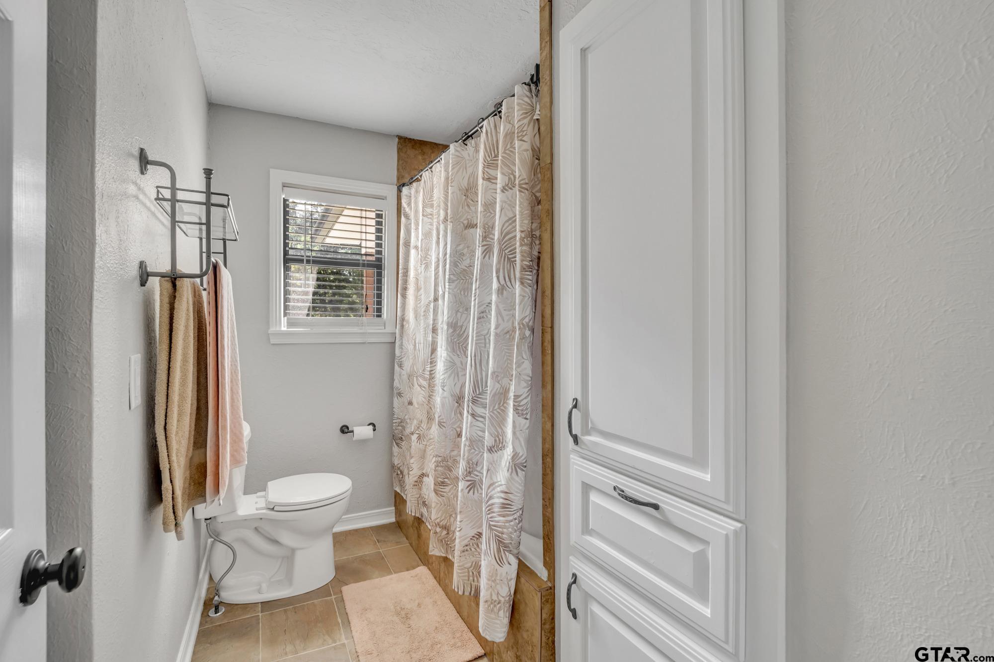 3601 Dumas Road Longview, TX 75604 - Photo 16 of 27 a bathroom with a toilet and a shower