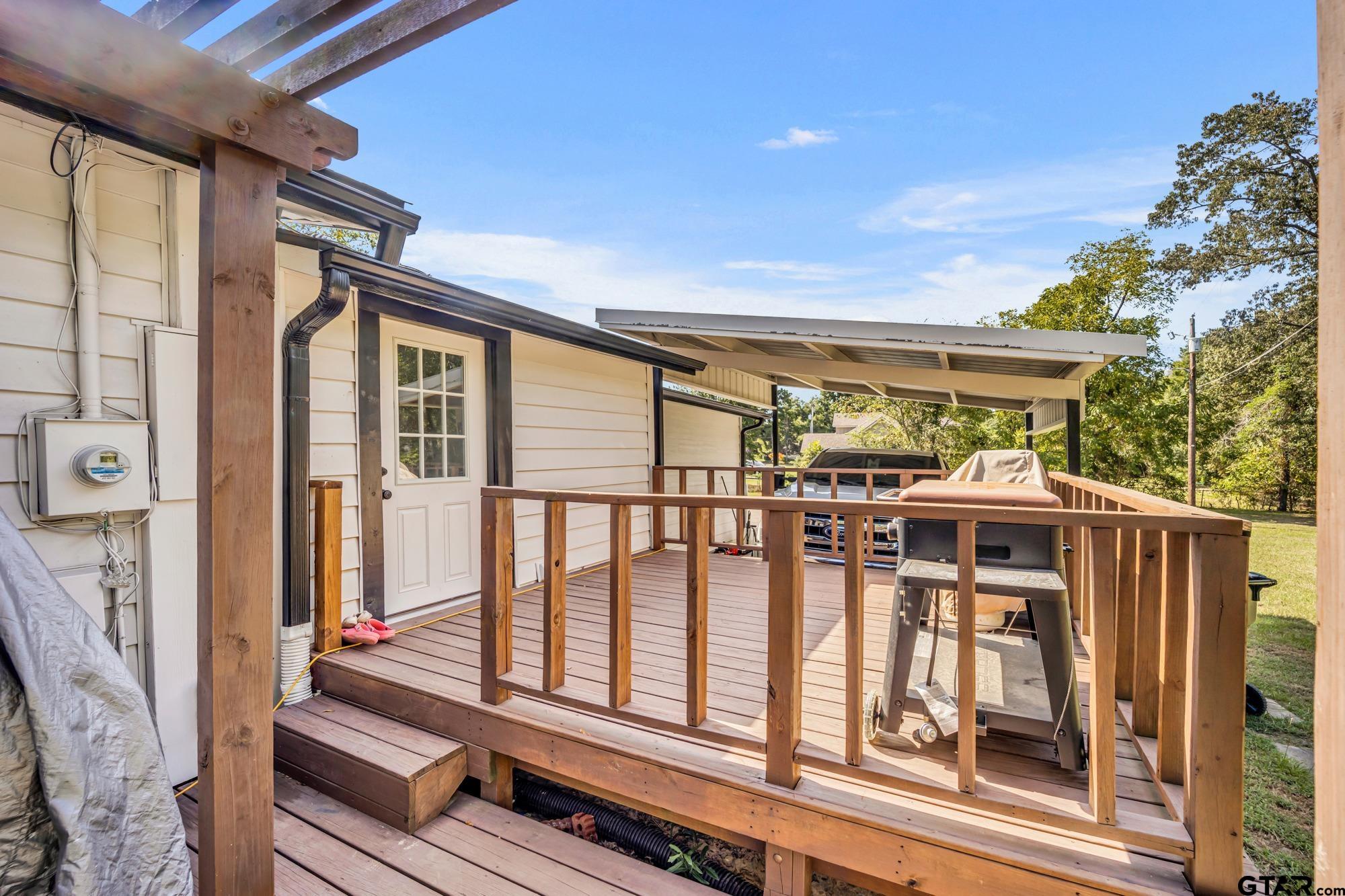 3601 Dumas Road Longview, TX 75604 - Photo 23 of 27 a view of a house with wooden floor and iron fence
