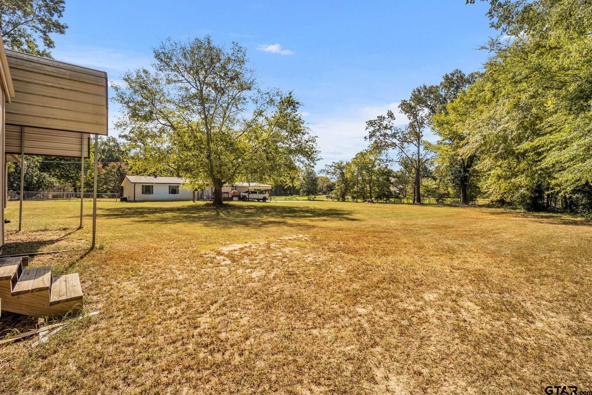 3601 Dumas Road Longview, TX 75604 - Photo 26 of 27 a swimming pool with outdoor seating and yard