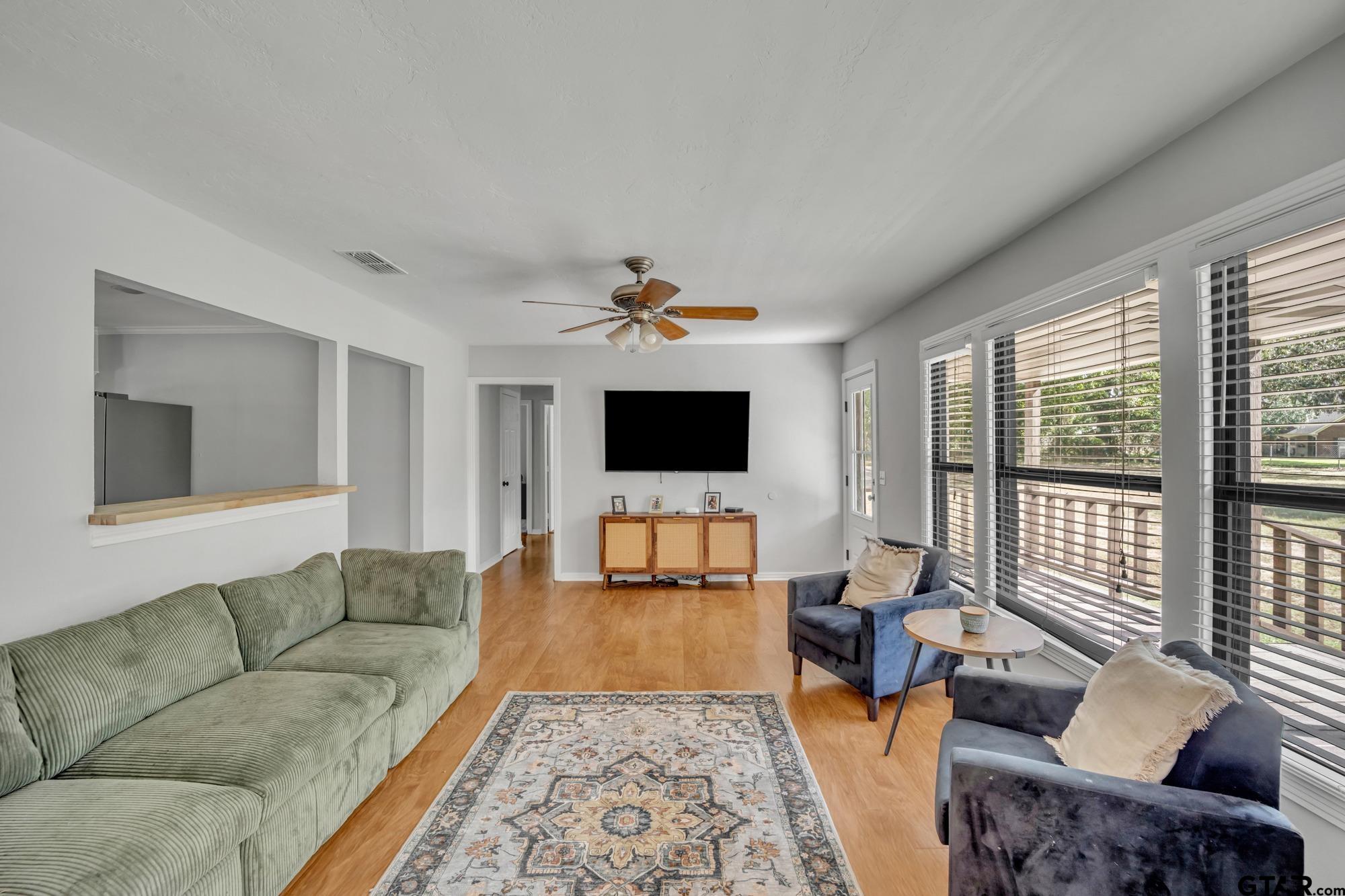 3601 Dumas Road Longview, TX 75604 - Photo 7 of 27 a living room with furniture and a flat screen tv