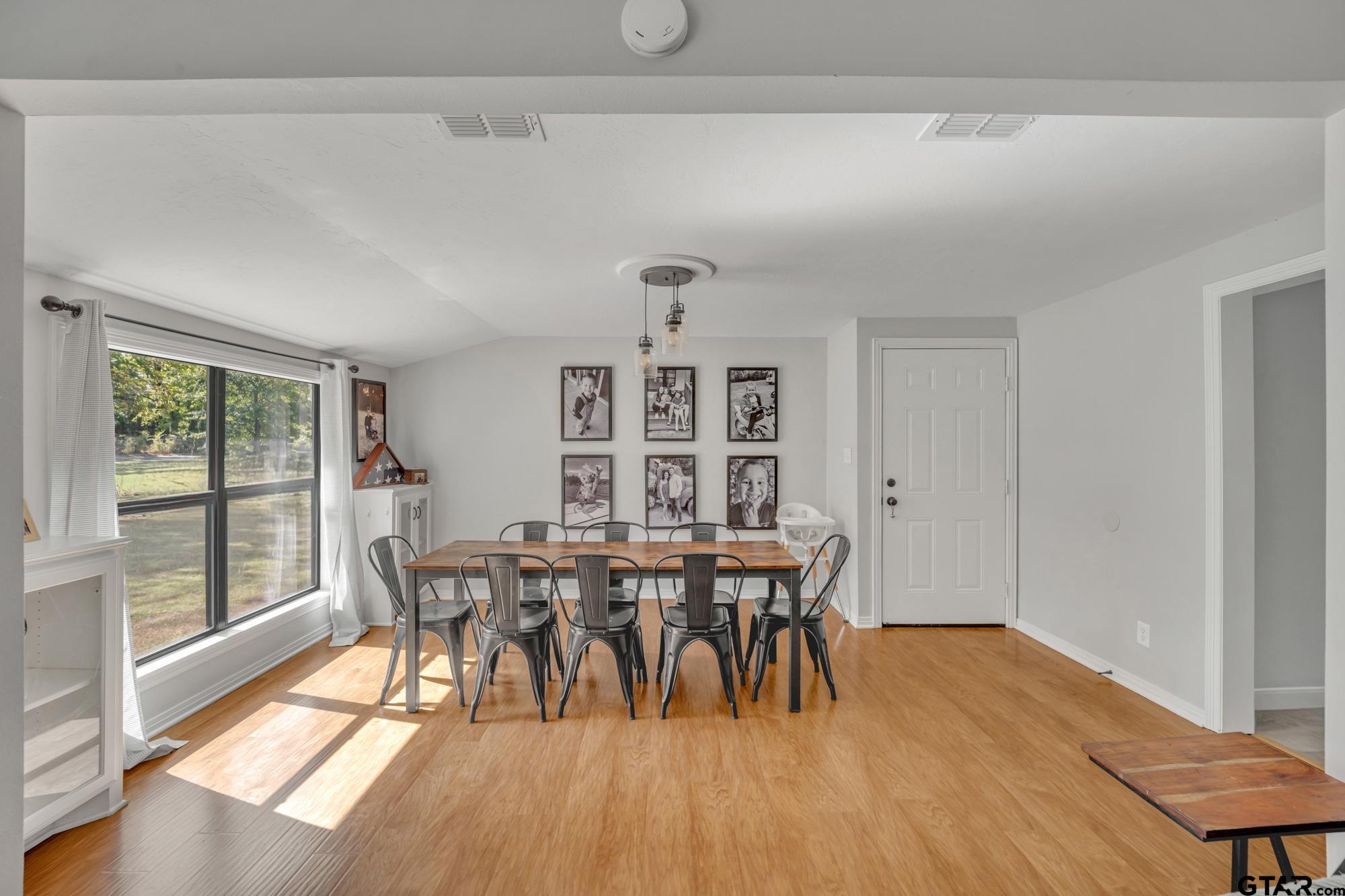 3601 Dumas Road Longview, TX 75604 - Photo 9 of 27 a view of a dining room with furniture and wooden floor