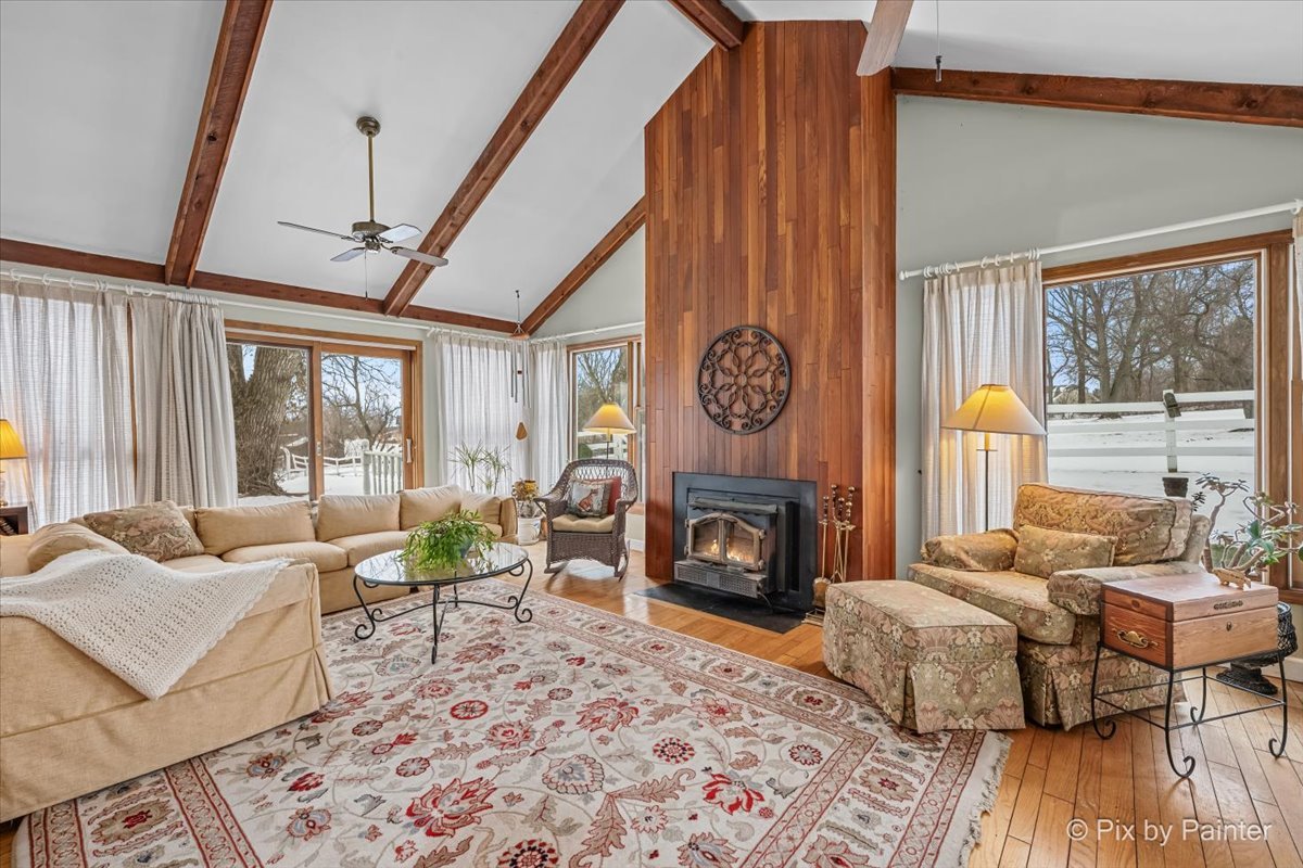 11N575 Rohrssen Road Elgin, IL 60120 - Photo 11 of 58 a living room with furniture and a fireplace