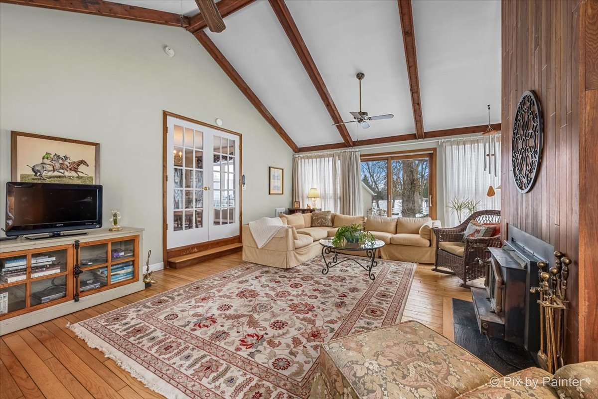 11N575 Rohrssen Road Elgin, IL 60120 - Photo 12 of 58 a living room with furniture and a flat screen tv