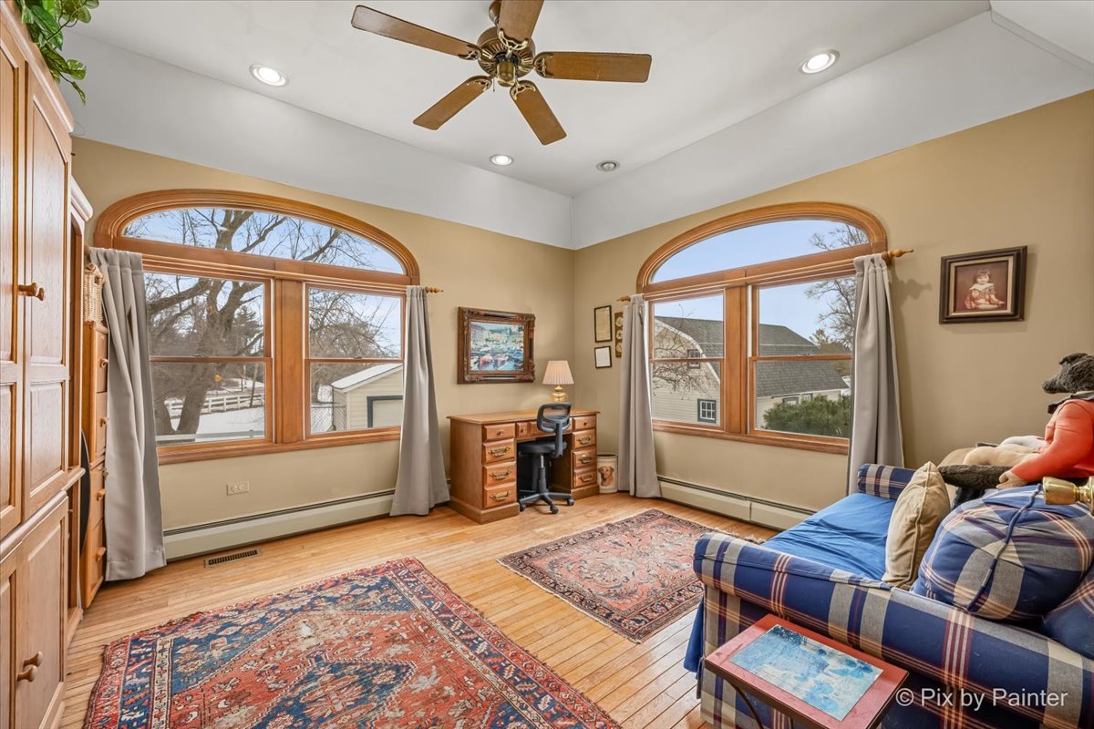 11N575 Rohrssen Road Elgin, IL 60120 - Photo 24 of 58 a living room with furniture and large windows