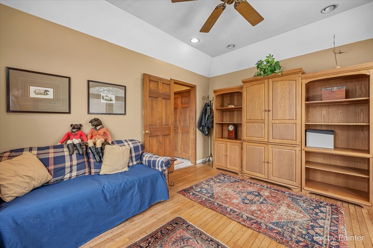 11N575 Rohrssen Road Elgin, IL 60120 - Photo 25 of 58 a living room with furniture and a flat screen tv