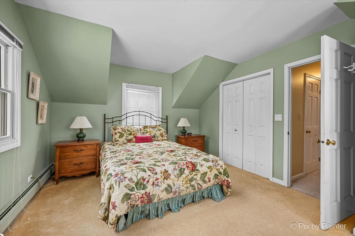 11N575 Rohrssen Road Elgin, IL 60120 - Photo 27 of 58 a bedroom with a bed and a dresser