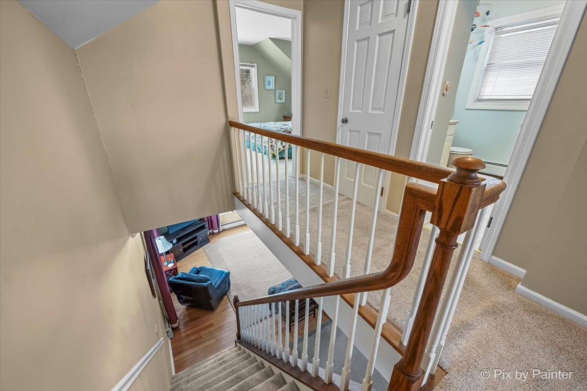 11N575 Rohrssen Road Elgin, IL 60120 - Photo 28 of 58 a view of staircase with railing and white walls