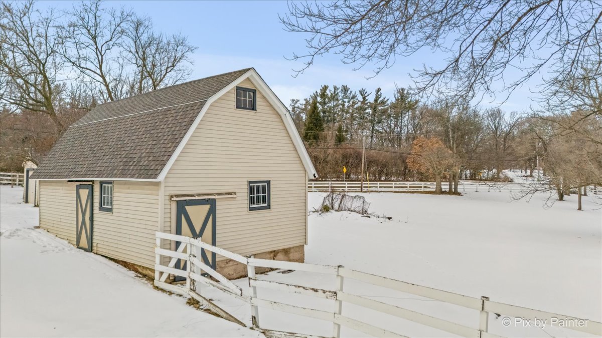 11N575 Rohrssen Road Elgin, IL 60120 - Photo 32 of 58 a view of a house with a snow in the yard