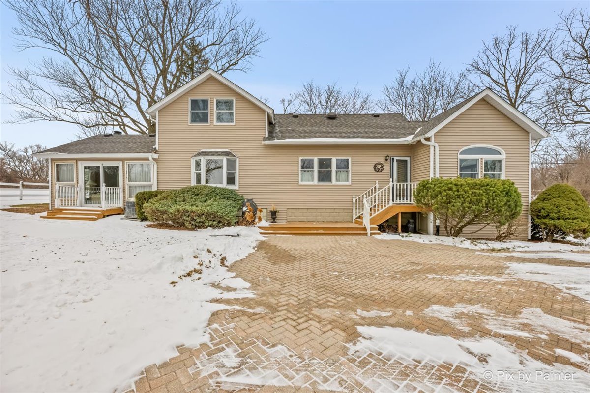 11N575 Rohrssen Road Elgin, IL 60120 - Photo 36 of 58 a front view of a house with a yard
