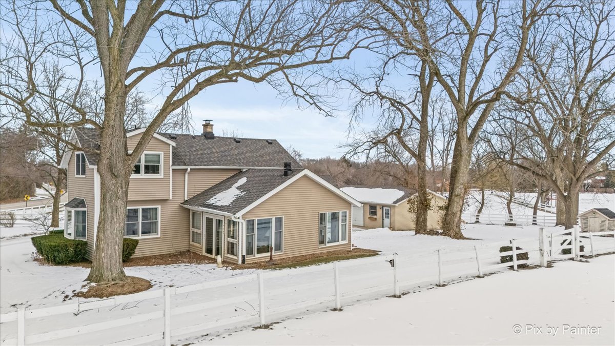 11N575 Rohrssen Road Elgin, IL 60120 - Photo 51 of 58 a view of house with a yard covered in snow